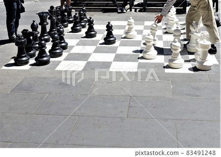 The sunshine is warm and the square is a chess board Melbourne Australia The sunshine is warm and the square is a chess board Melbourne Australia 83491248