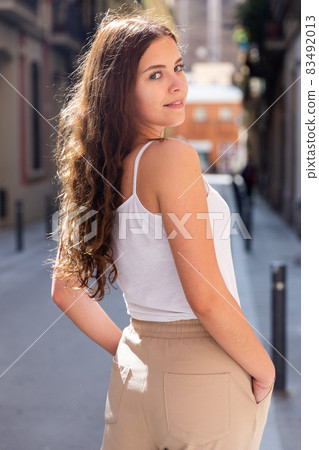 Portrait of cheerful woman standing on city street Portrait of cheerful woman standing on city street 83492013