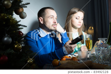 Bored couple celebrating Christmas 83492128