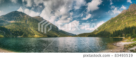 Tatra National Park, Poland. Famous Mountains Lake Morskie Oko Or Sea Eye Lake In Summer Morning. Beautiful Sunrise Sunrays Above Tatras Lake Landscape 83493519