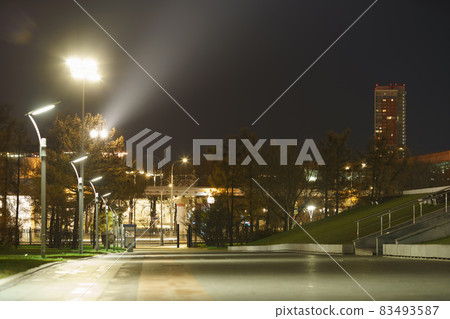 Long exposure photography of alley in the Mocow public park, Cosmonauts Alley near VDNH (VDNKH). Monorail bridge. Beautiful view. Leisure and lifestyle concept during coronavirus pandemic. Long exposure photography of alley in the Mocow public park, Cosmonauts Alley near VDNH (VDNKH). Monorail bridge. Beautiful view. Leisure and lifestyle concept during coronavirus pandemic. 83493587
