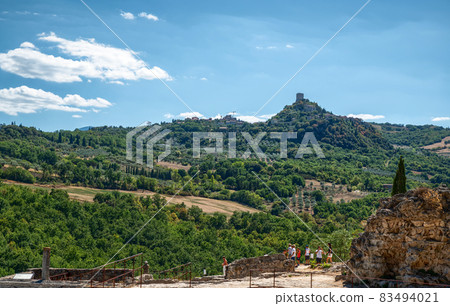 Bagno Vignoni, Tuscany, Italy. August 2020. The amazing landscape of the Tuscan countryside visible from the viewpoint of the Tuscan village. Bagno Vignoni, Tuscany, Italy. August 2020. The amazing landscape of the Tuscan countryside visible from the viewpoint of the Tuscan village. 83494021