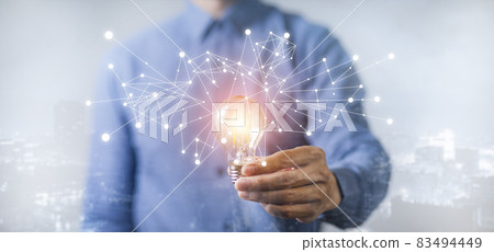 Businessman hand holding light bulb with line connect and working on the desk, Creativity and innovation are keys to success.Concept of new idea and innovation with energy and power , working at home, Businessman hand holding light bulb with line connect and working on the desk, Creativity and innovation are keys to success.Concept of new idea and innovation with energy and power , working at home, 83494449
