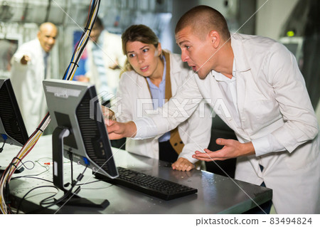Friends trying to solve conundrum in quest room in view as abandoned lab Friends trying to solve conundrum in quest room in view as abandoned lab 83494824