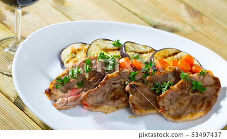 Barbecued lamb chops with aubergine Barbecued lamb chops with aubergine 83497437