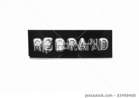 Black color banner that have embossed letter with word rebrand on white paper background 83498480