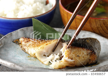 Eat a breakfast set of grilled sablefish and miso soup that looks delicious with fat on it 83498657