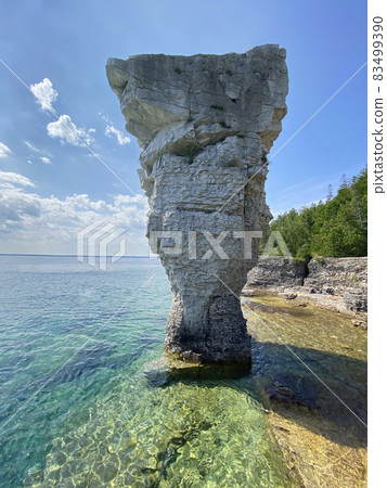 Pillar rock rise from the waters of Georgian Bay on Flowerpot island in Fathom Five National Marine Park, Lake Huron, Canada 83499390