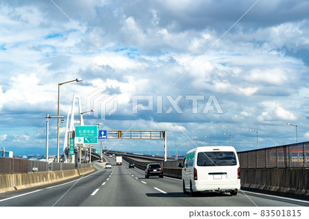 Passenger cars and trucks traveling on the Isewangan Expressway in Aichi Prefecture Passenger cars and trucks traveling on the Isewangan Expressway in Aichi Prefecture 83501815