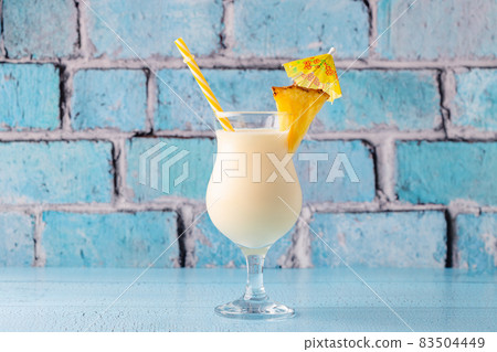 Traditional caribbean cocktail pina colada in a glass. 83504449