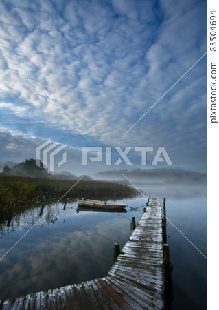 Lake and boat in Denmark in Autumn Lake and boat in Denmark in Autumn 83504694