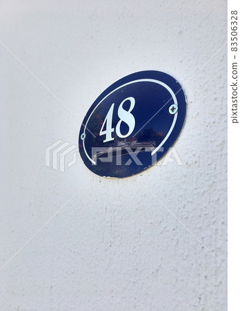 Close up of an house door number 48 Close up of an house door number 48 83506328