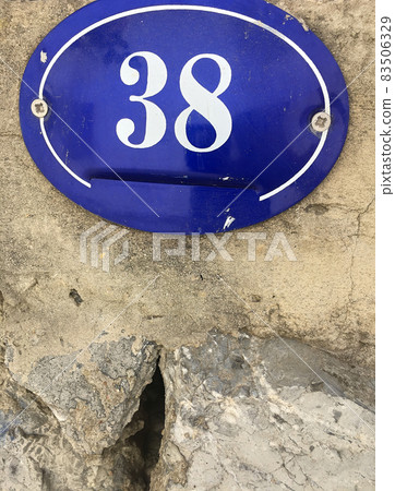 Close up of an house door number 38 Close up of an house door number 38 83506329
