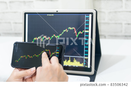 A business examines the financial graph of sales growth on the computer A business examines the financial graph of sales growth on the computer 83506342