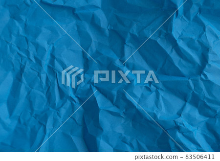 Blue crumpled wrinkled paper pattern surface texture background. Blue crumpled wrinkled paper pattern surface texture background. 83506411