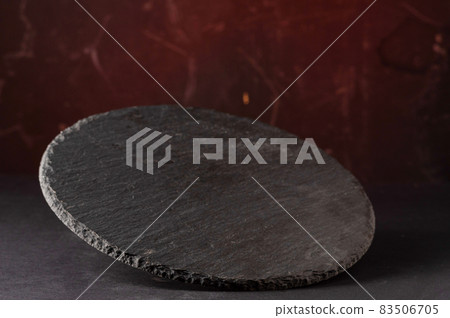 Round food stand. Diverse red background. Flying tray on a red background. 83506705