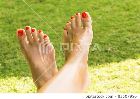 Bare feet on a meadow 83507950