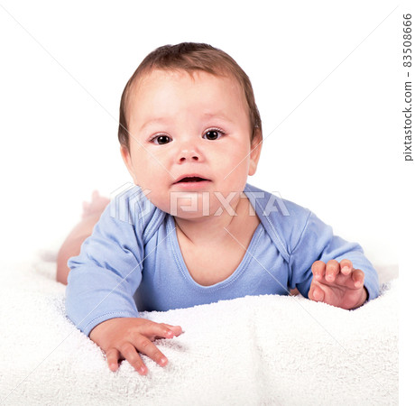 Little baby boy lying on the bed on white background 83508666