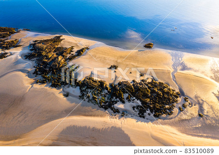 The coast between Kiltoorish bay beach and the Sheskinmore bay between Ardara and Portnoo in Donegal - Ireland 83510089