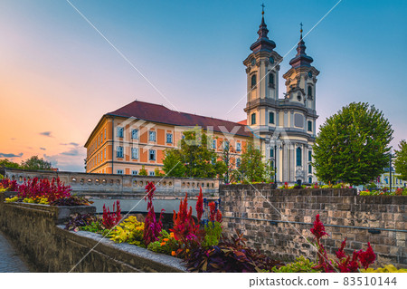 Catholic church view from the waterfront at dawn, Eger, Hungary 83510144