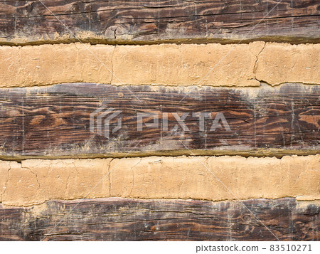 Cladding detail of the wall of an old half-timbered cottage Cladding detail of the wall of an old half-timbered cottage 83510271