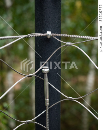 End tensioning joints on a modern wire fence. Anchor eye End tensioning joints on a modern wire fence. Anchor eye 83510775
