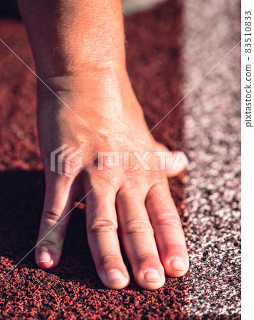 Starting line with outstretched fingers. Stadium racetrack Starting line with outstretched fingers. Stadium racetrack 83510833