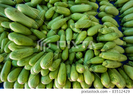 A bunch of zucchini on the bazaar counter. A bunch of zucchini on the bazaar counter. 83512429