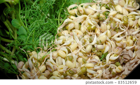 Close-up photo of the plate with sprouted seeds of pea, bean, mung 83512659