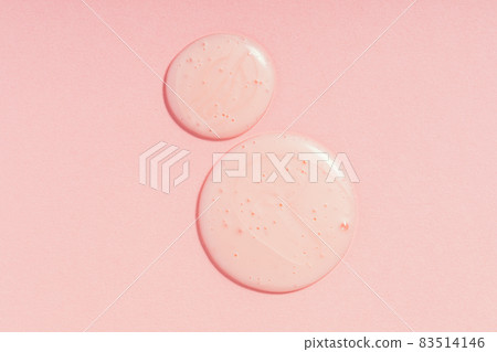 Drops of cosmetic gel on pink background 83514146