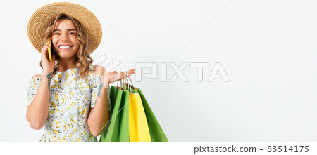 Beautiful woman in summer dress and straw hat 83514175
