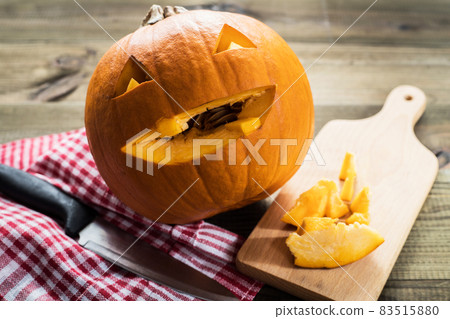 Halloween Jack-o-lantern carved pumpkin. Making backstage. 83515880