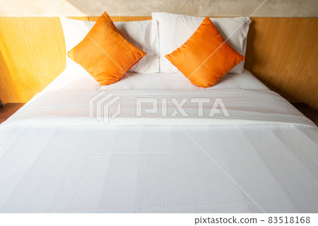 View of comfortable Double bed in bedroom decoration in cozy style. Conceptual of a room in a home where people sleep. View of comfortable Double bed in bedroom decoration in cozy style. Conceptual of a room in a home where people sleep. 83518168