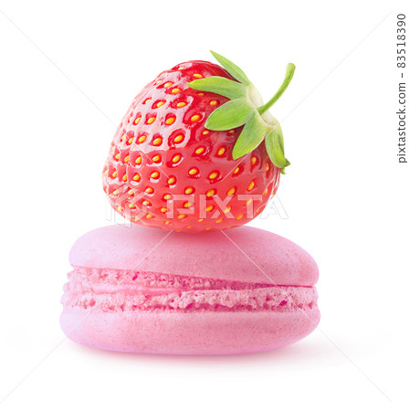 One strawberry on top of pink macaroon isolated on white background One strawberry on top of pink macaroon isolated on white background 83518390