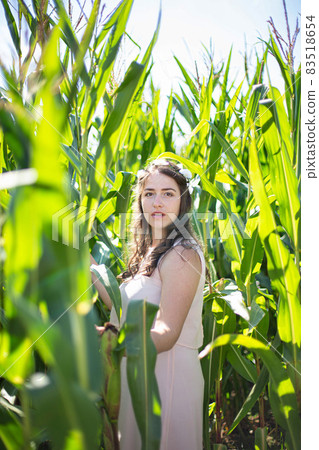 Young european woman in tall grass Young european woman in tall grass 83518654