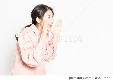 A woman making a cheering gesture A woman making a cheering gesture 83519562