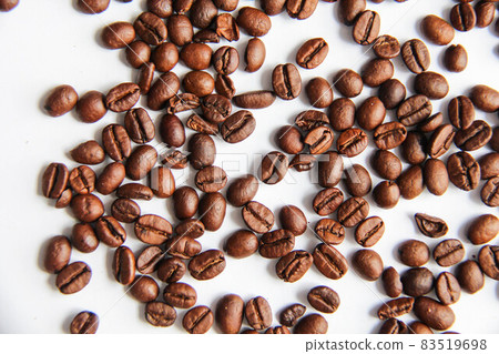 Roasted coffee beans with white background. Close view of coffee beans Roasted coffee beans with white background. Close view of coffee beans 83519698