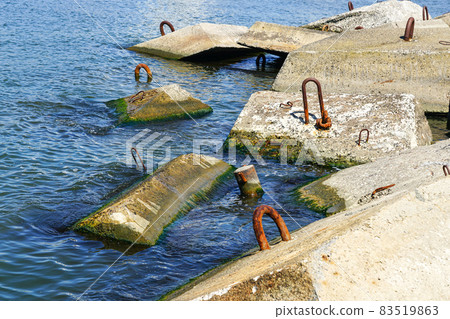 port breakwater concrete blocks in the water with metal hooks port breakwater concrete blocks in the water with metal hooks 83519863