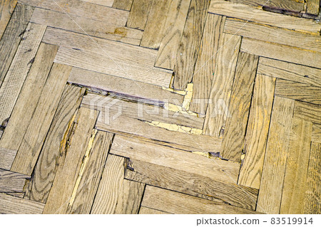 old worn out natural wood parquet with defects 83519914