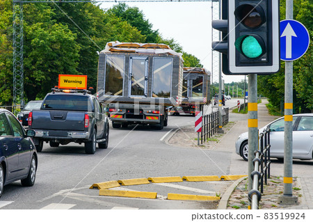transportation of prefabricated oversized modular houses on a road of general interest transportation of prefabricated oversized modular houses on a road of general interest 83519924