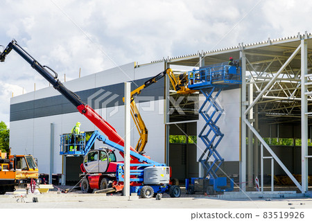 use of modern telescopic crane and scissor lifts in sandwich panel wall mounting 83519926