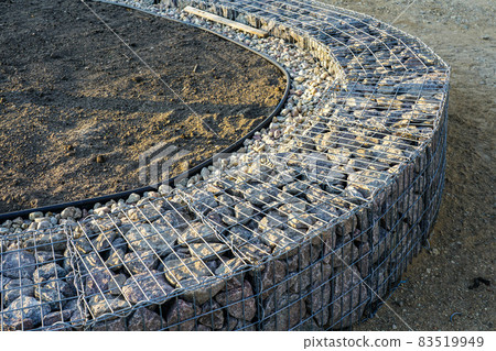 unfinished gabion fence wall construction from steel mesh with stones unfinished gabion fence wall construction from steel mesh with stones 83519949