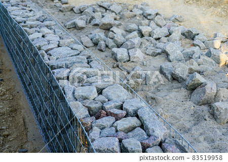 unfinished gabion fence wall construction from steel mesh with stones unfinished gabion fence wall construction from steel mesh with stones 83519958