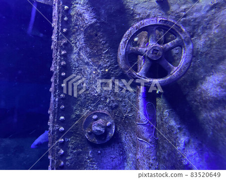 silver iron valve against the background of a steel submarine door silver iron valve against the background of a steel submarine door 83520649