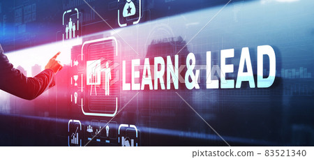 Learn and Lead. Businessman presses hand on the virtual screen inscription 83521340