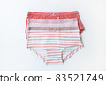Set of multicolored cotton baby panties, underwear for girls on white background. Top view, copy space, flat lay, close-up. Children's clothing concept, wardrobe organization. Horizontal 83521749