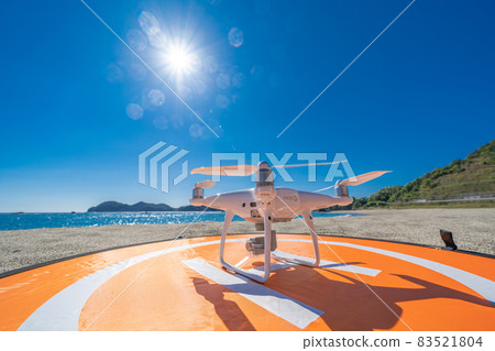 [Sea] Drone and landing pad [Sandy beach] 83521804