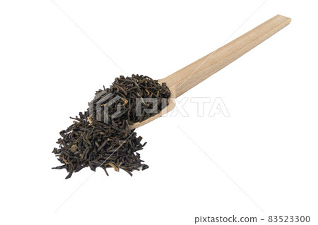 yunnan black tea on wooden spoon isolated on white background. yunnan black tea on wooden spoon isolated on white background. 83523300