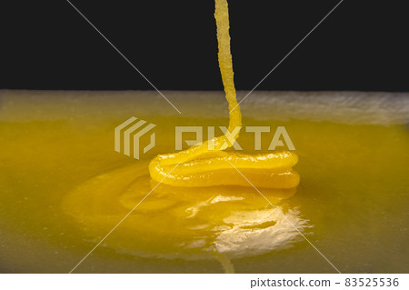 Fresh viscous floral honey flows onto the plate. vitamin organic food 83525536