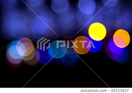 Colored blurred bokeh. abstract background of included festive garlands. colorful blur light bulbs Colored blurred bokeh. abstract background of included festive garlands. colorful blur light bulbs 83525637